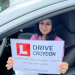 Successful Drive Croydon learner celebrating a practical driving test pass